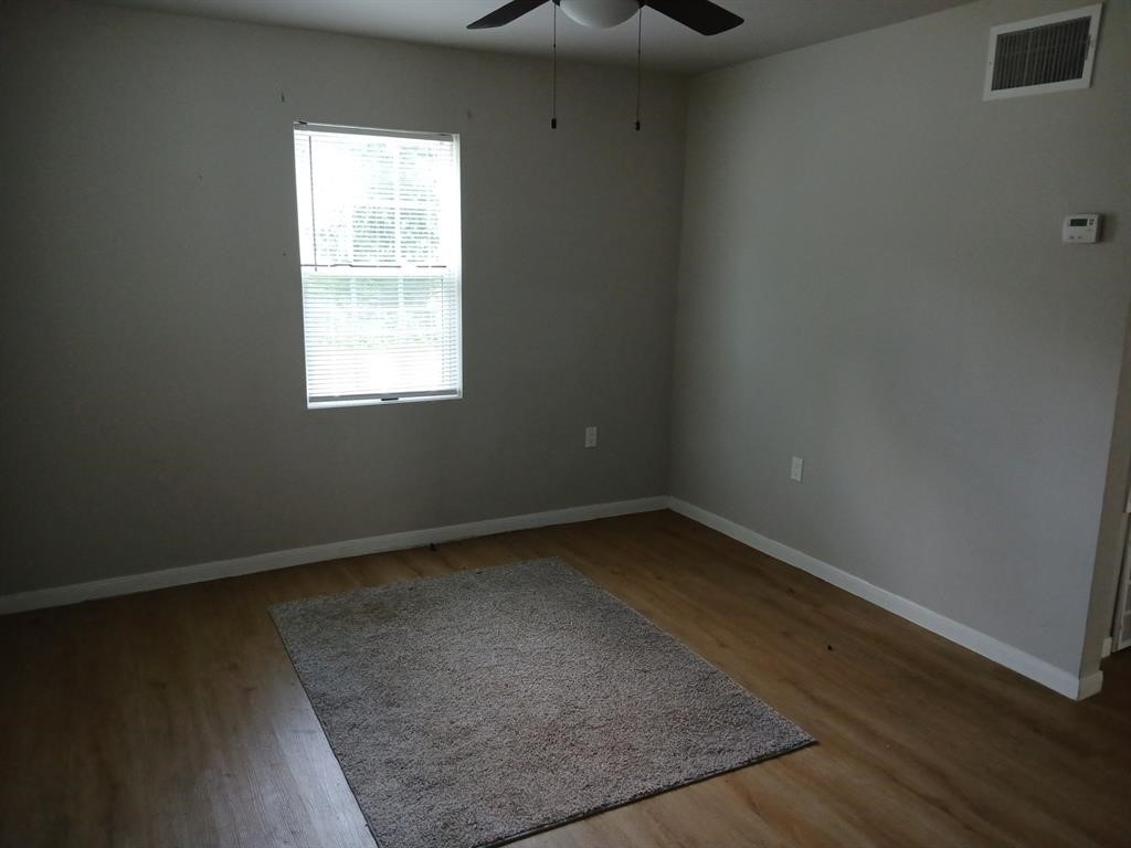 15519 Highway 6 Santa Fe, TX 77517 - Photo 5 of 14 an empty room with a window