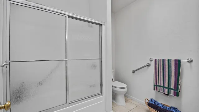 a bathroom with a shower and a toilet