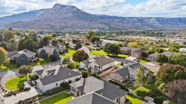 an aerial view of residential house with outdoor space and parking