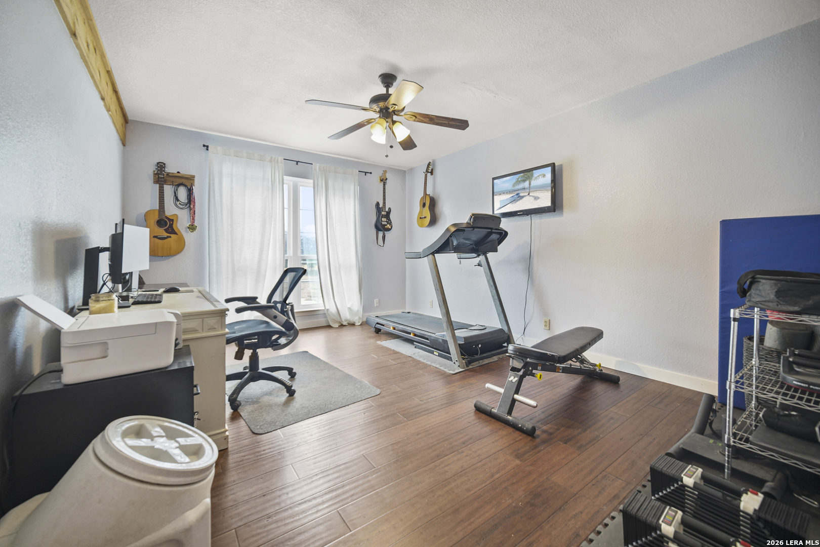 25 Poehnert Road Boerne, TX 78006 - Photo 23 of 37 a view of a workspace with furniture and gym equipment