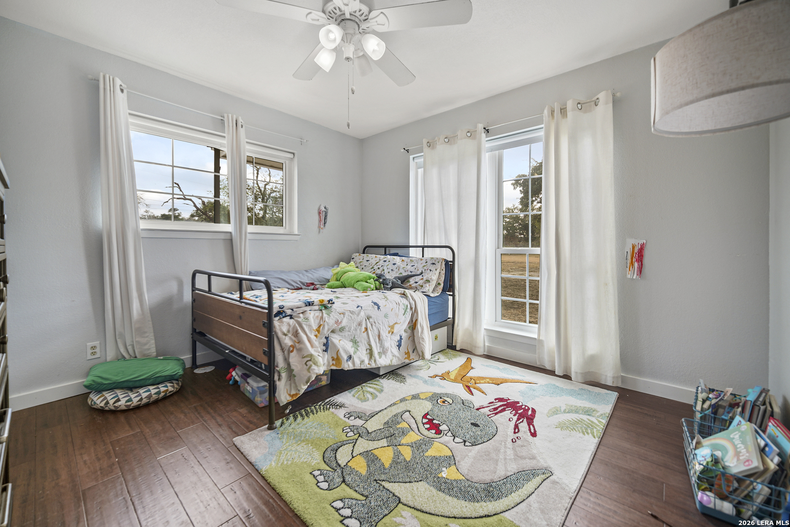 25 Poehnert Road Boerne, TX 78006 - Photo 26 of 37 a bedroom with bed and a wooden floor