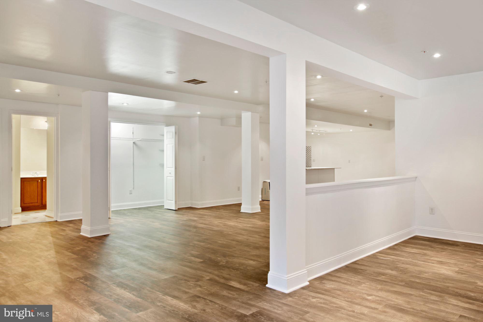 6803 Ironbridge Lane Laurel, MD 20707 - Photo 46 of 60 Large finished basement with luxury plank floors