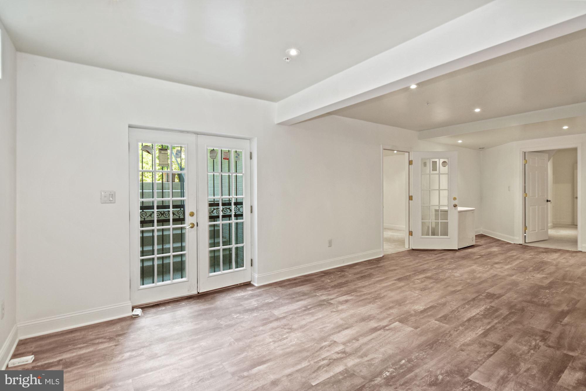 6803 Ironbridge Lane Laurel, MD 20707 - Photo 47 of 60 Large finished basement with luxury plank floors