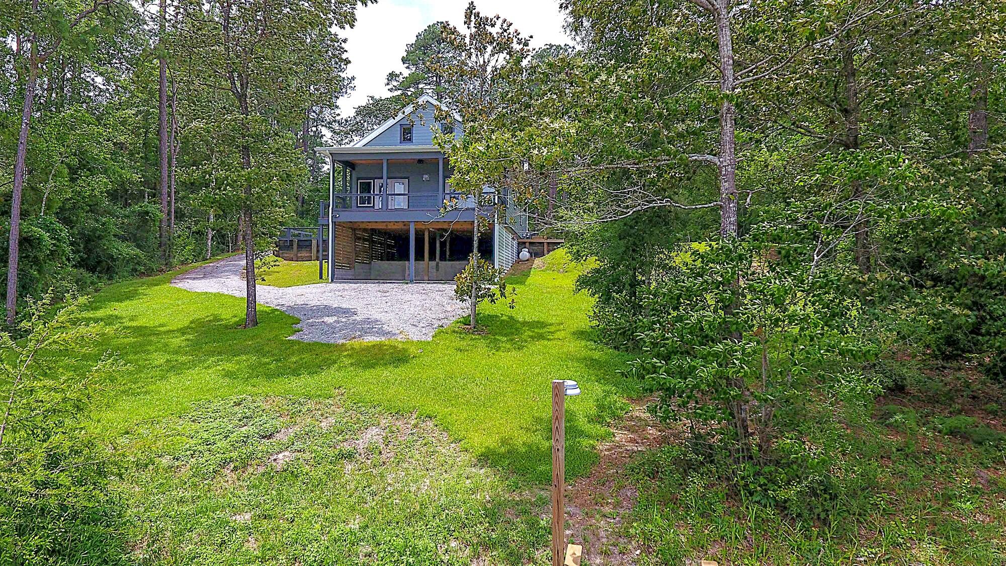 888 Spring Lake Road DeFuniak Springs, FL 32433 - Photo 4 of 75 a front view of house with yard and green space