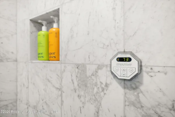 a bathroom with a sink and mirror