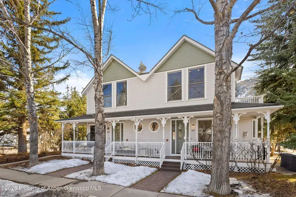 a front view of a house with parking area