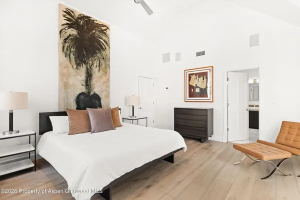 a bedroom with furniture and a fireplace