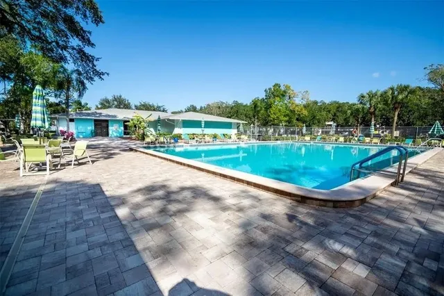 a view of a swimming pool with a patio