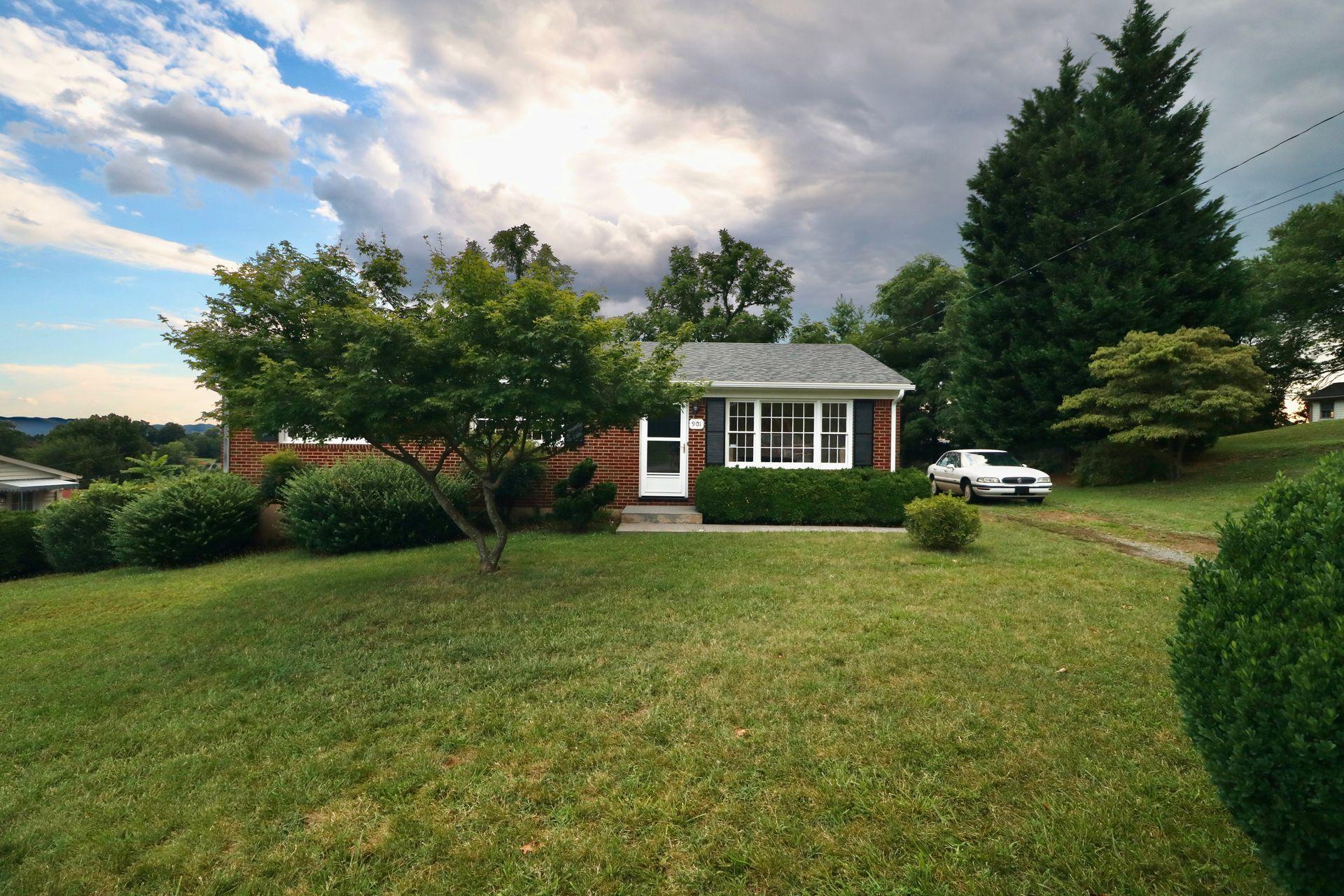901 Olney Road Vinton, VA 24179 - Photo 2 of 42 a house view with garden space and trees