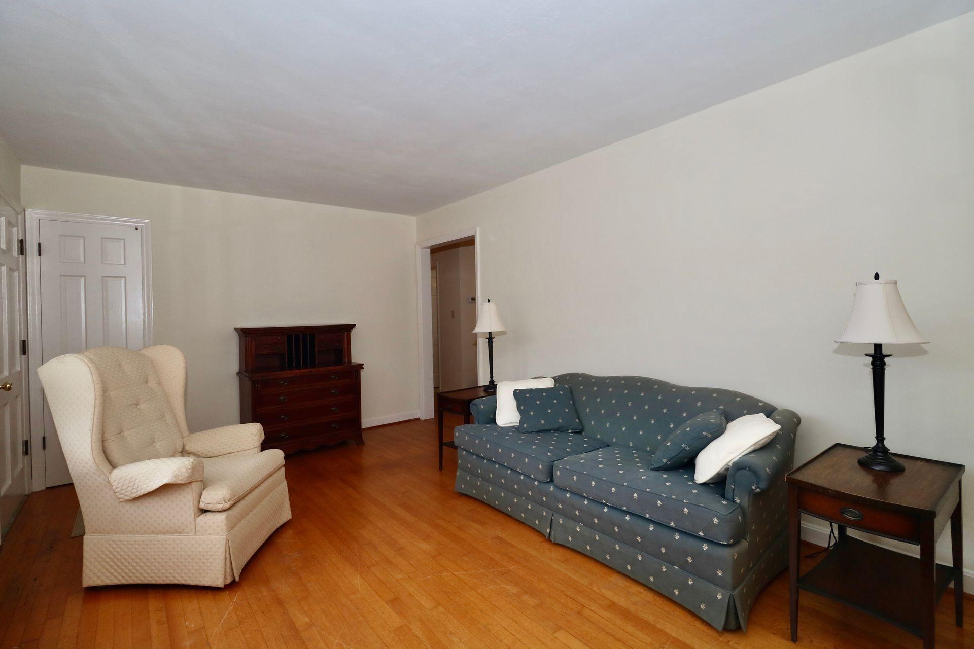 901 Olney Road Vinton, VA 24179 - Photo 14 of 42 a living room with furniture and a lamp