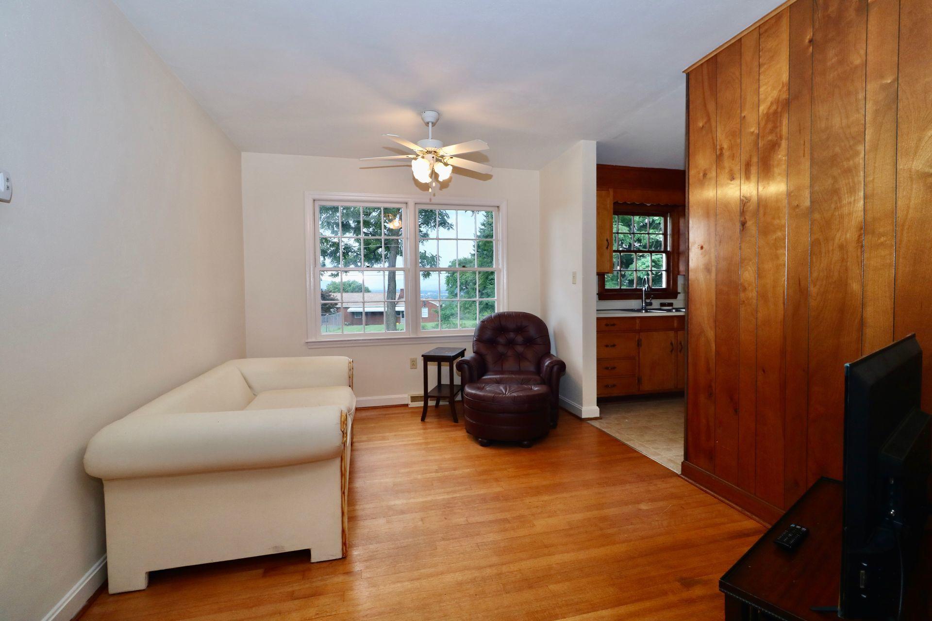 901 Olney Road Vinton, VA 24179 - Photo 16 of 42 a living room with furniture and a flat screen tv