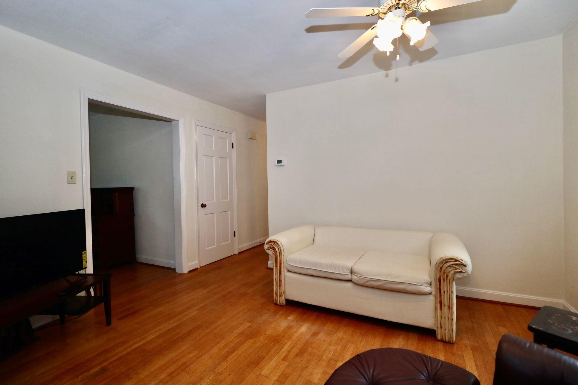 901 Olney Road Vinton, VA 24179 - Photo 17 of 42 a room with a bed and a flat screen tv