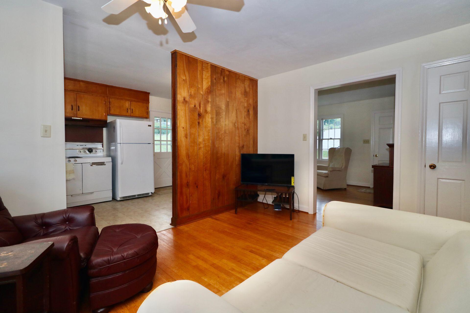 901 Olney Road Vinton, VA 24179 - Photo 18 of 42 a living room with furniture and a flat screen tv