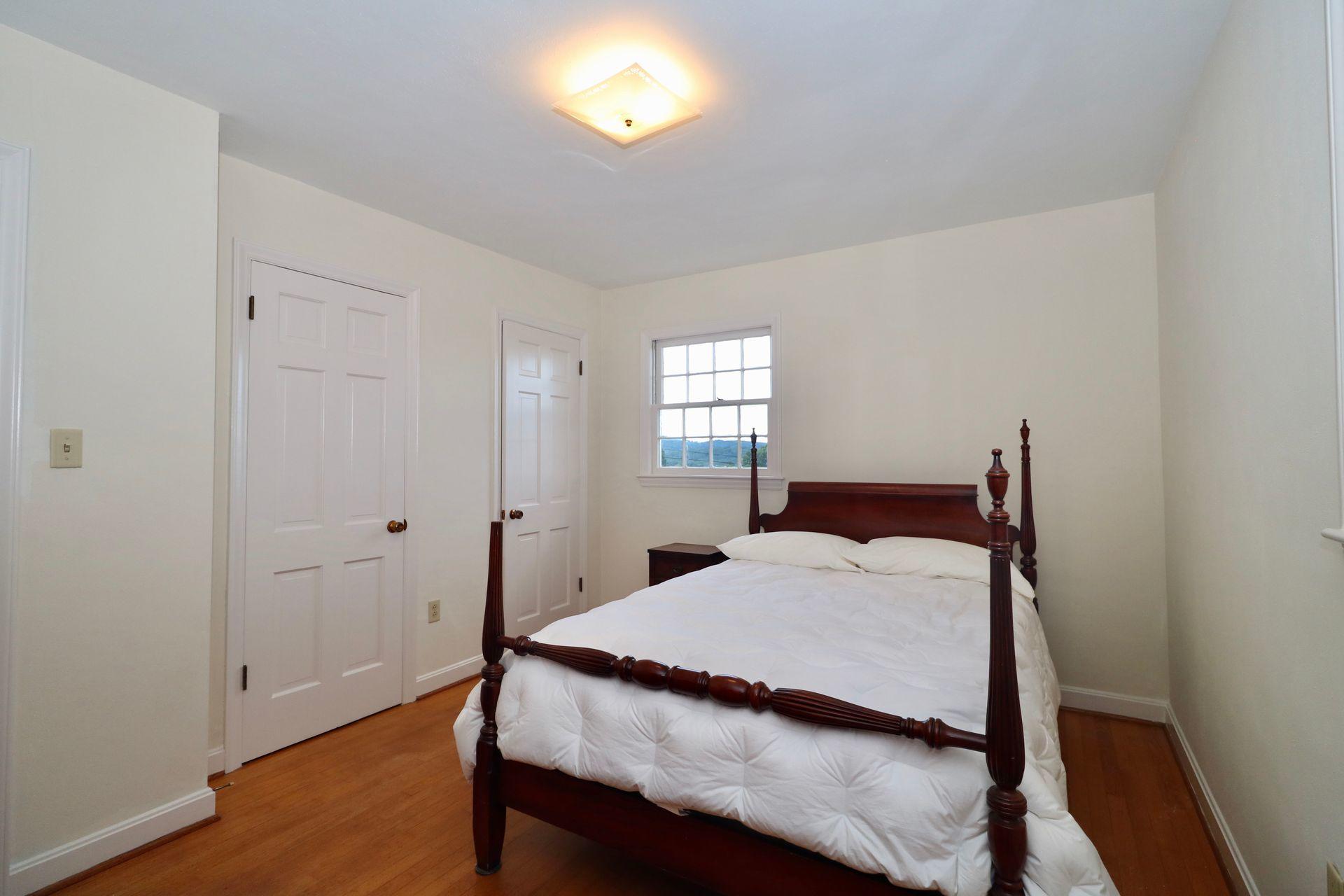 901 Olney Road Vinton, VA 24179 - Photo 23 of 42 a bedroom with a bed and a window