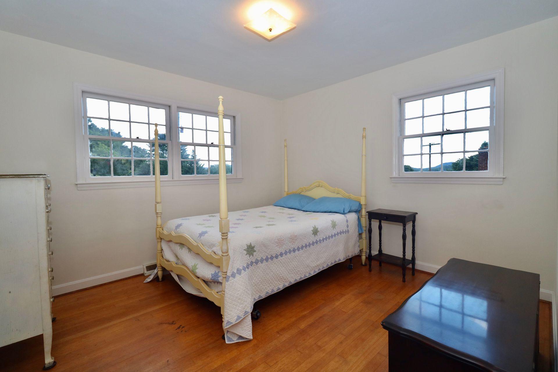 901 Olney Road Vinton, VA 24179 - Photo 26 of 42 a bedroom with a bed and window