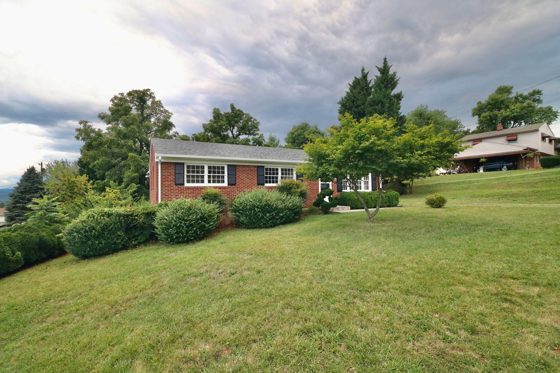 901 Olney Road Vinton, VA 24179 - Photo 5 of 42 a front view of a house with a yard
