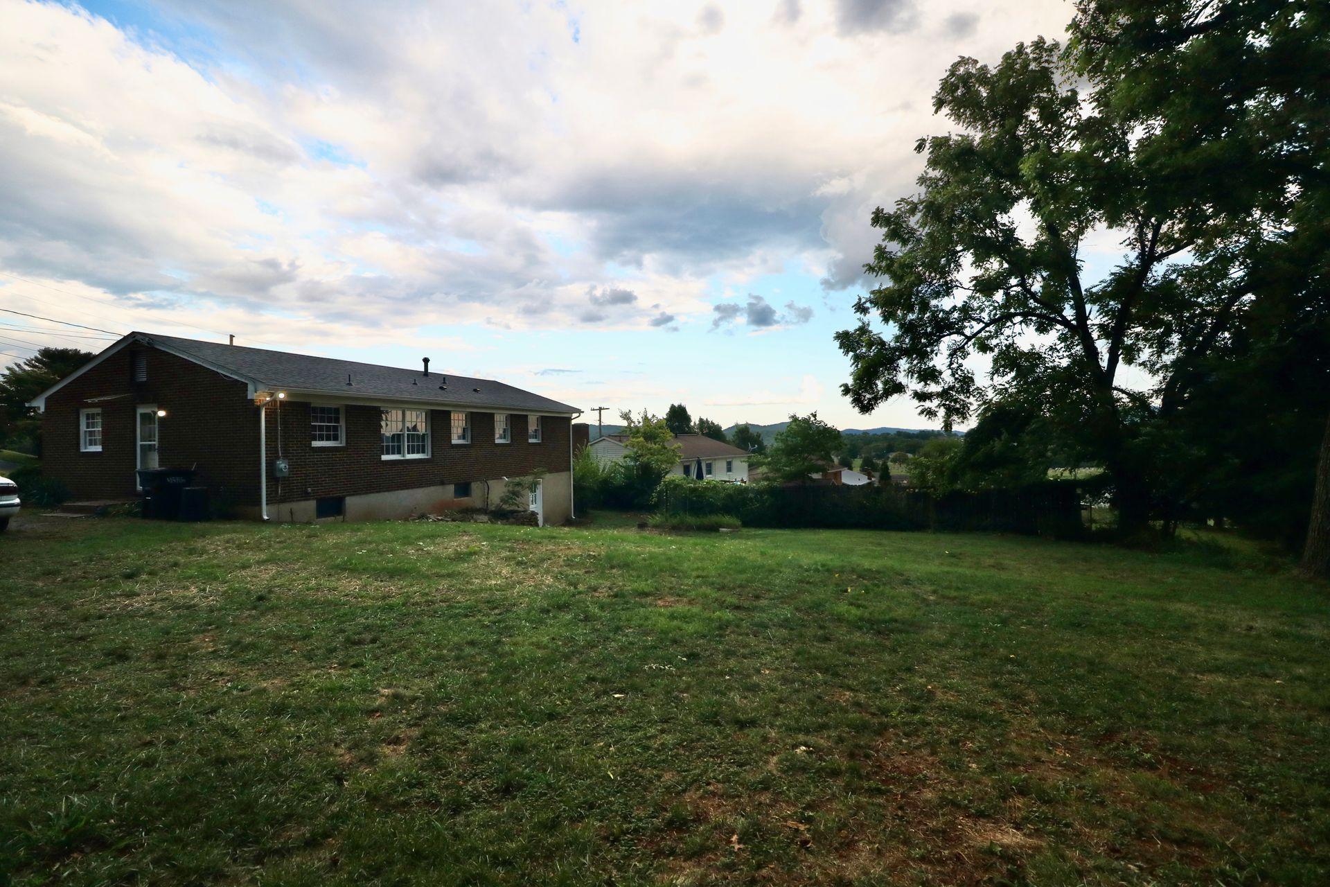 901 Olney Road Vinton, VA 24179 - Photo 42 of 42 a view of a barn in the middle of a yard