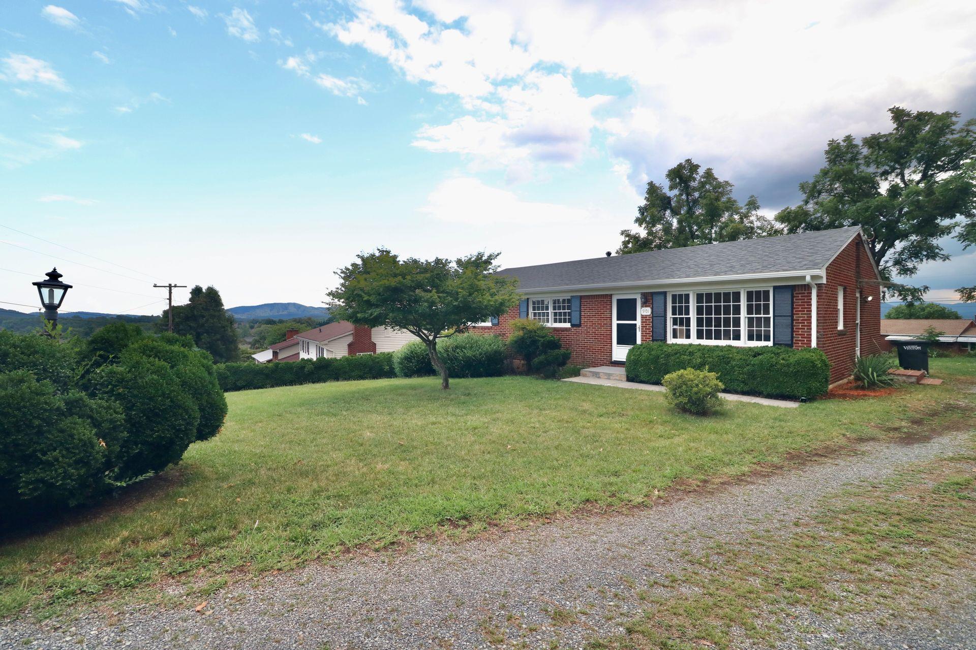 901 Olney Road Vinton, VA 24179 - Photo 8 of 42 a front view of a house with a yard