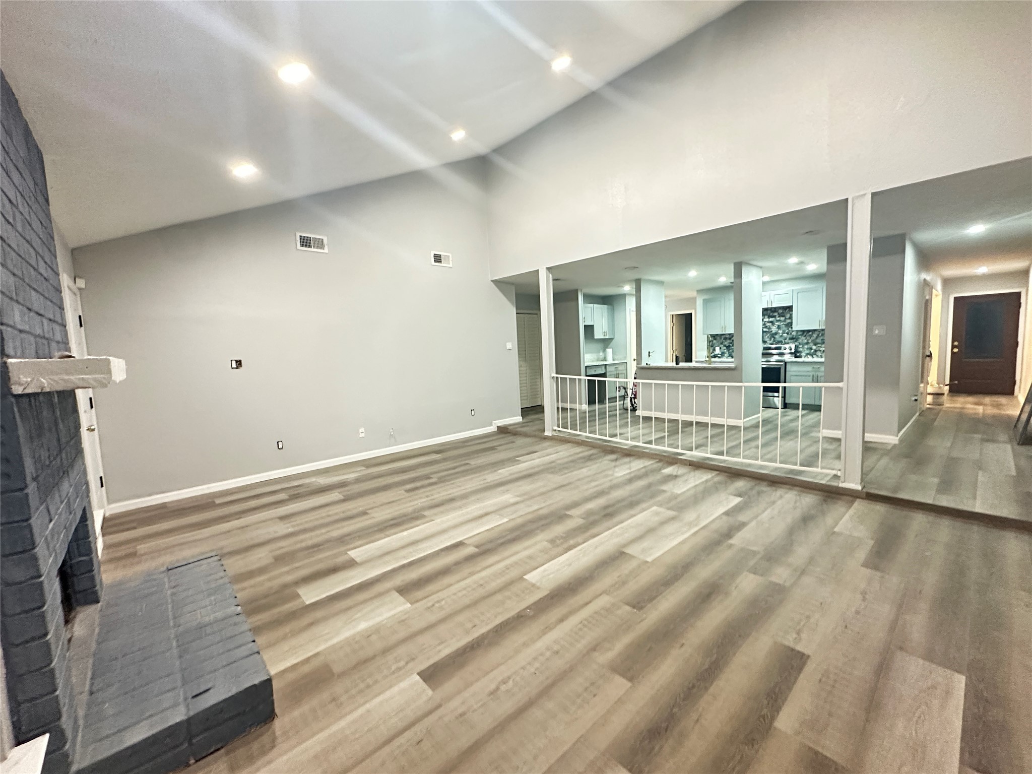 9631 Stockwell Street Houston, TX 77083 - Photo 14 of 23 a view of a livingroom with wooden floor and furniture