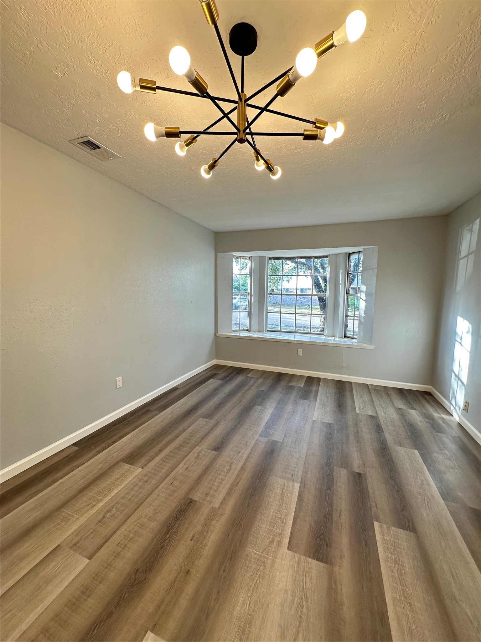9631 Stockwell Street Houston, TX 77083 - Photo 15 of 23 a view of an empty room and window