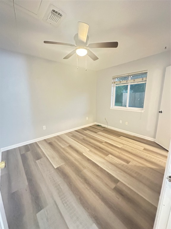 9631 Stockwell Street Houston, TX 77083 - Photo 17 of 23 a view of a room with a ceiling fan and a window