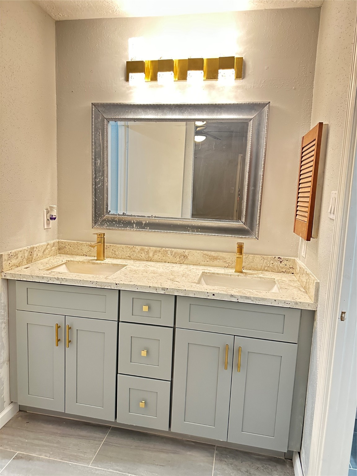 9631 Stockwell Street Houston, TX 77083 - Photo 18 of 23 a bathroom with a sink and a mirror