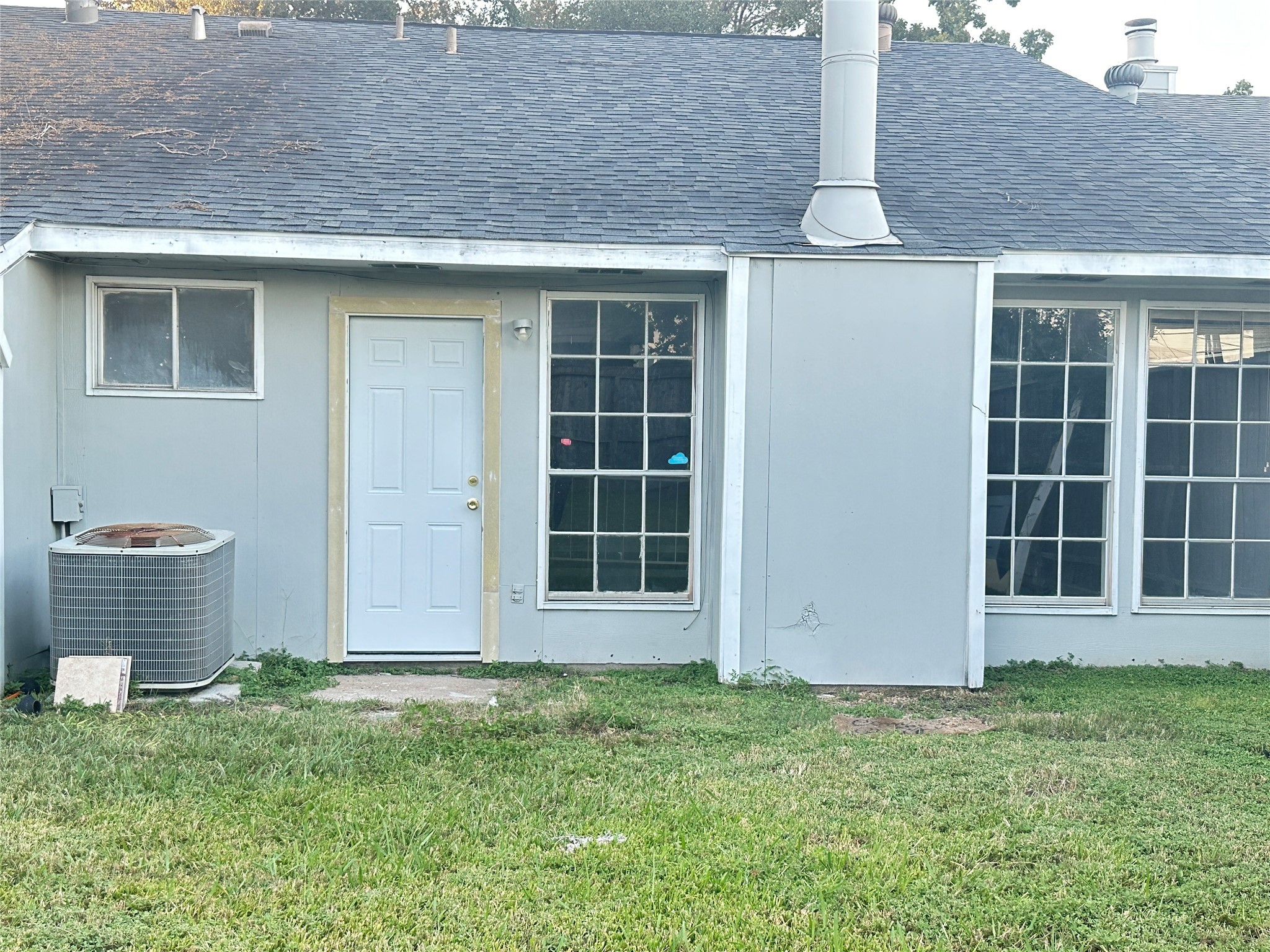 9631 Stockwell Street Houston, TX 77083 - Photo 22 of 23 a front view of a house with a garden