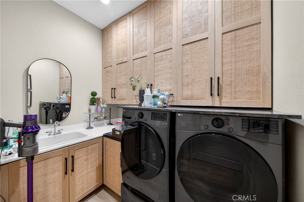 16375 Ory Circle Riverside, CA 92503 - Photo 37 of 51 a utility room with sink dryer and washer