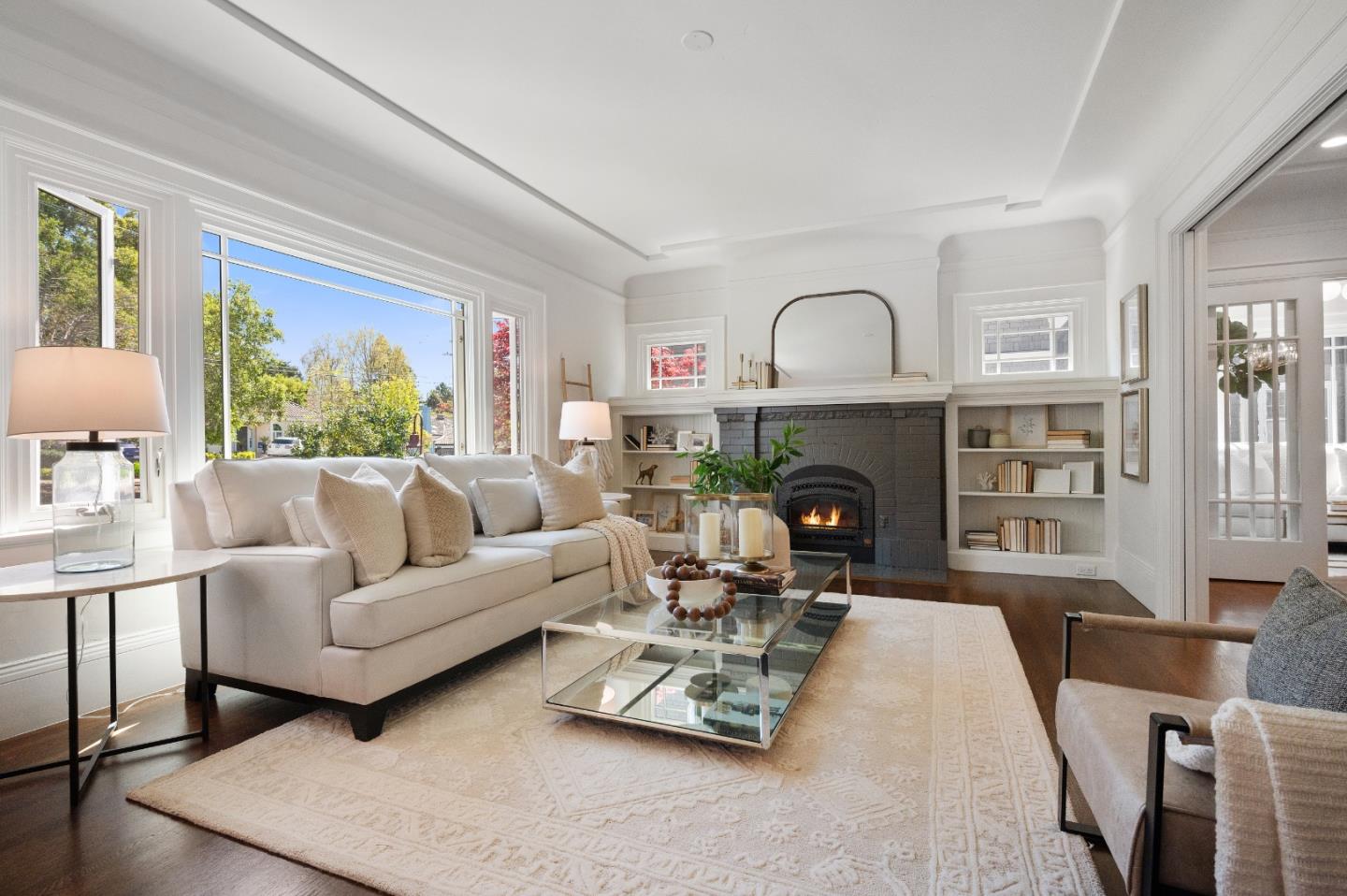 170 Warren Road San Mateo, CA 94401 - Photo 14 of 56 a living room with furniture a fireplace and a large window