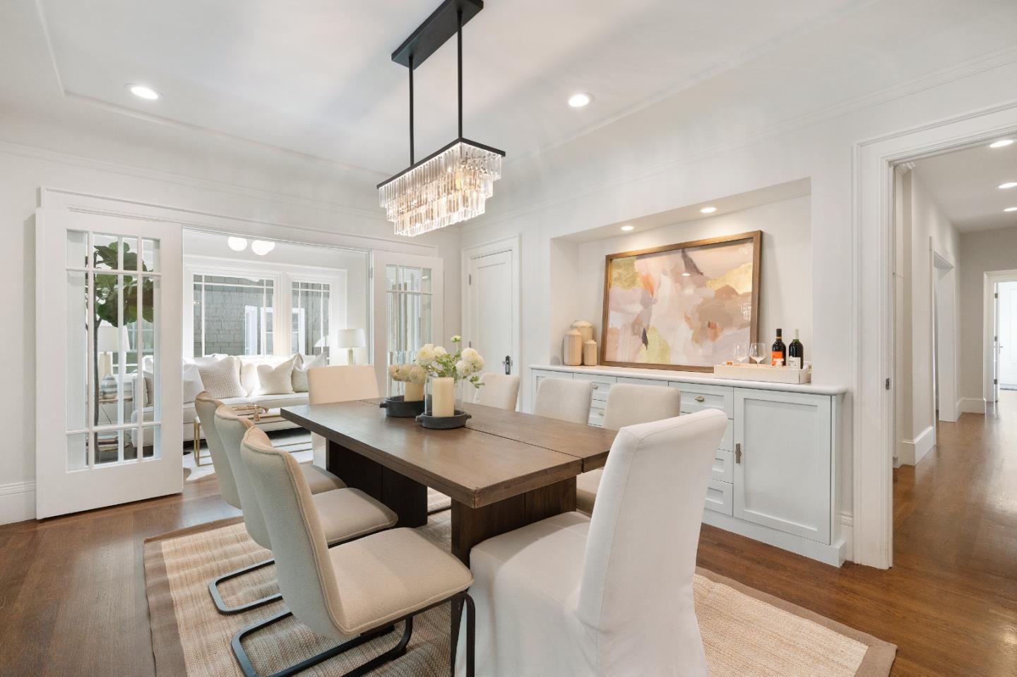 170 Warren Road San Mateo, CA 94401 - Photo 18 of 56 a view of a dining room with furniture wooden floor and chandelier