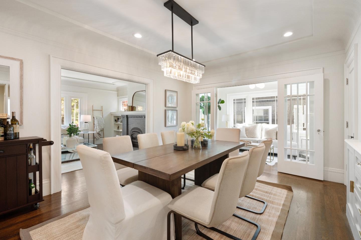 170 Warren Road San Mateo, CA 94401 - Photo 20 of 56 a view of a dining room with furniture wooden floor and chandelier