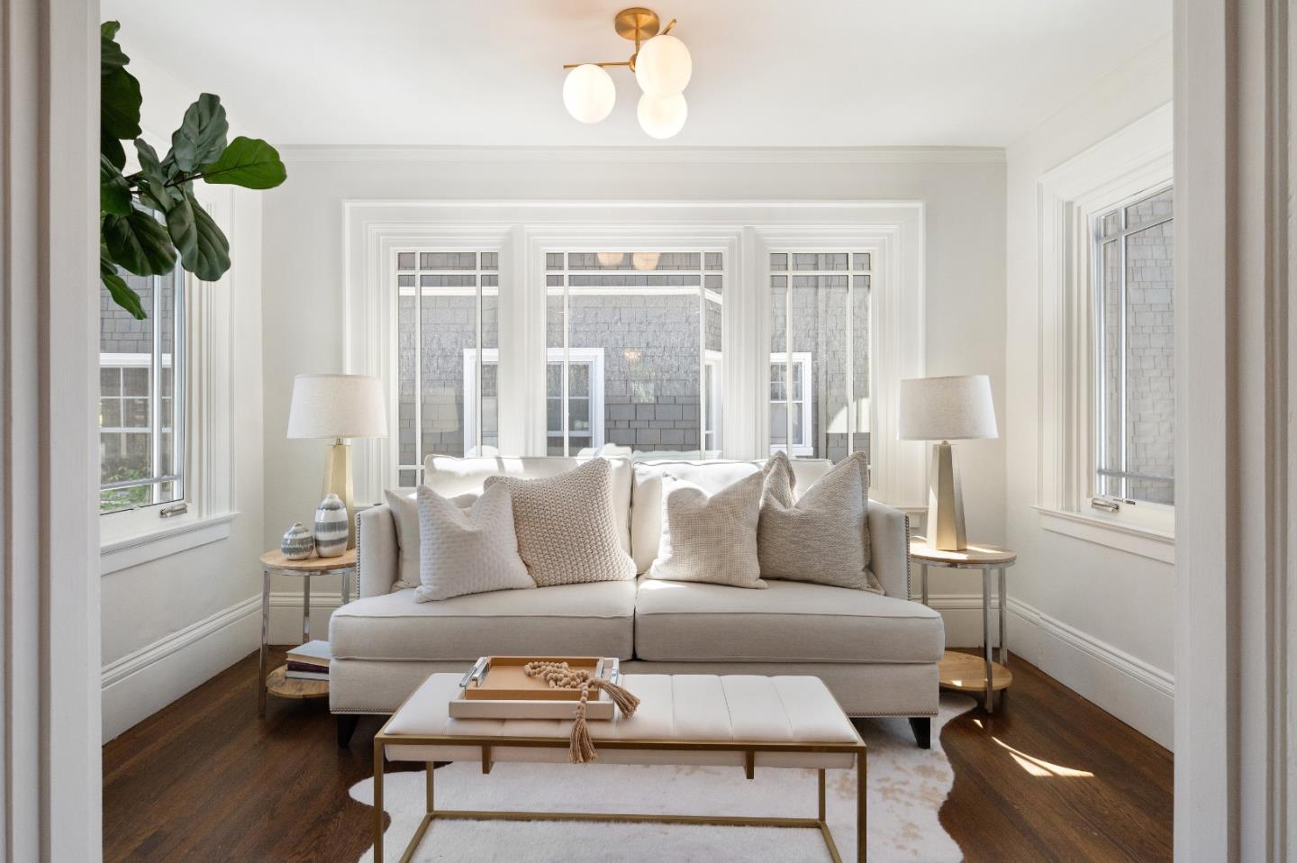 170 Warren Road San Mateo, CA 94401 - Photo 24 of 56 a living room with furniture a chandelier and a window