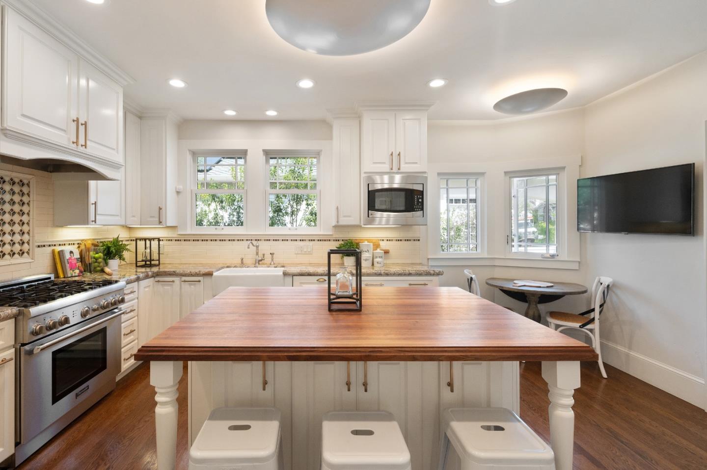 170 Warren Road San Mateo, CA 94401 - Photo 26 of 56 a kitchen with a stove a sink and a microwave