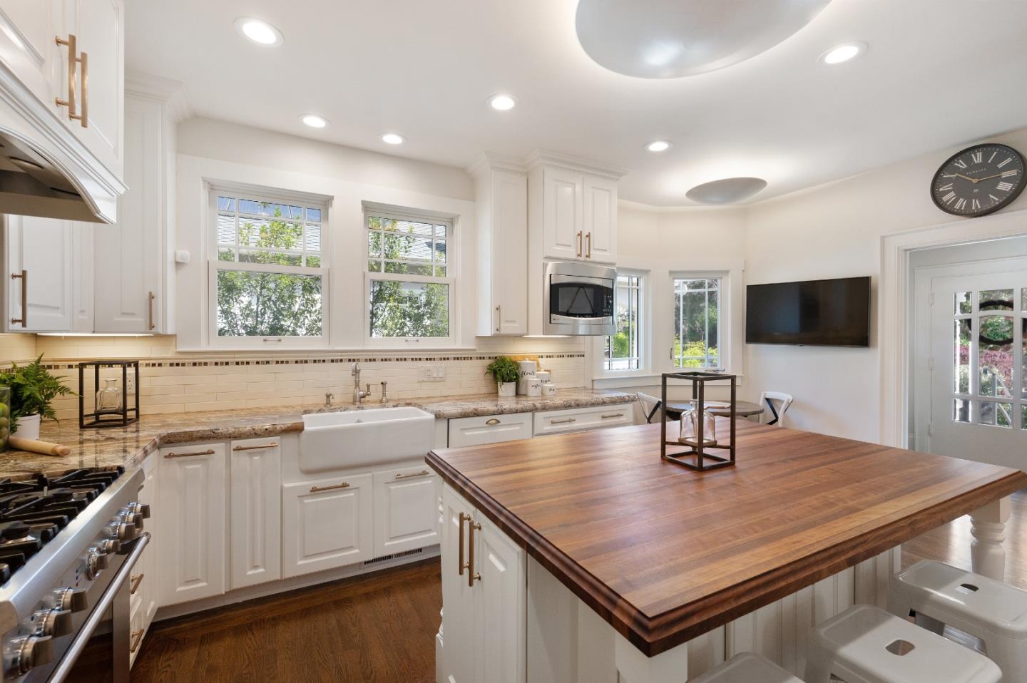 170 Warren Road San Mateo, CA 94401 - Photo 27 of 56 a kitchen with a sink a stove and cabinets