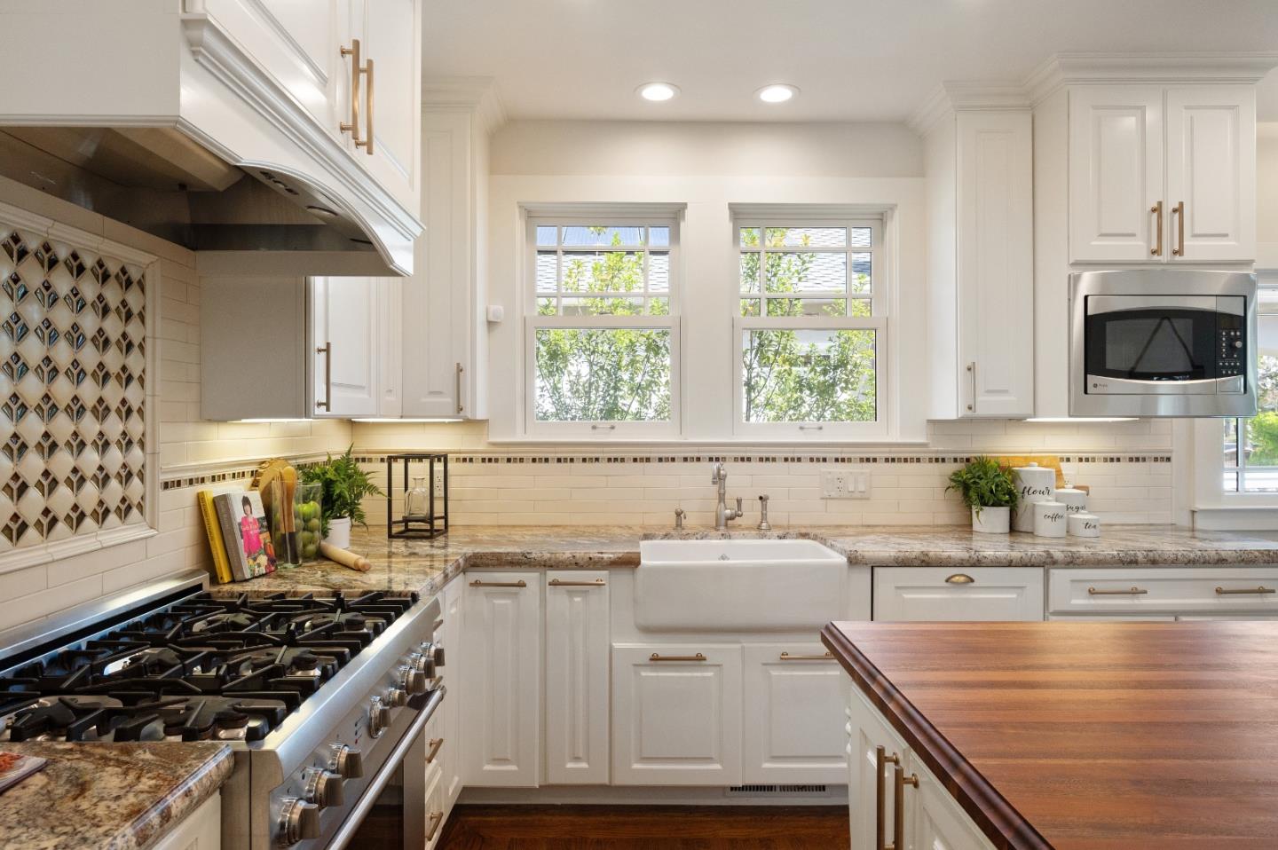 170 Warren Road San Mateo, CA 94401 - Photo 29 of 56 a kitchen that has a sink and a stove in it