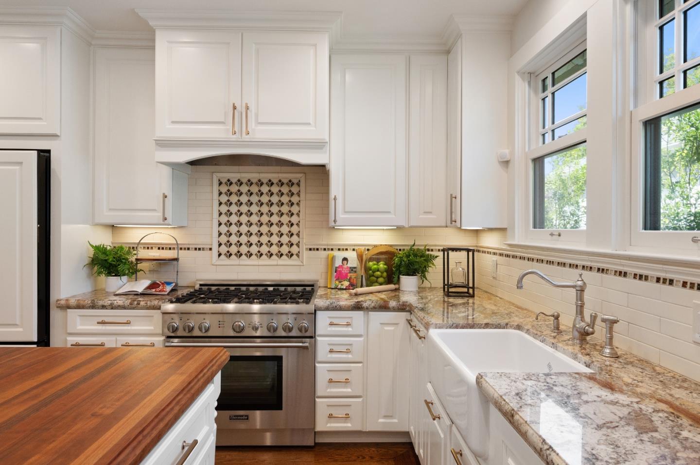 170 Warren Road San Mateo, CA 94401 - Photo 30 of 56 a kitchen with granite countertop a sink stainless steel appliances and cabinets