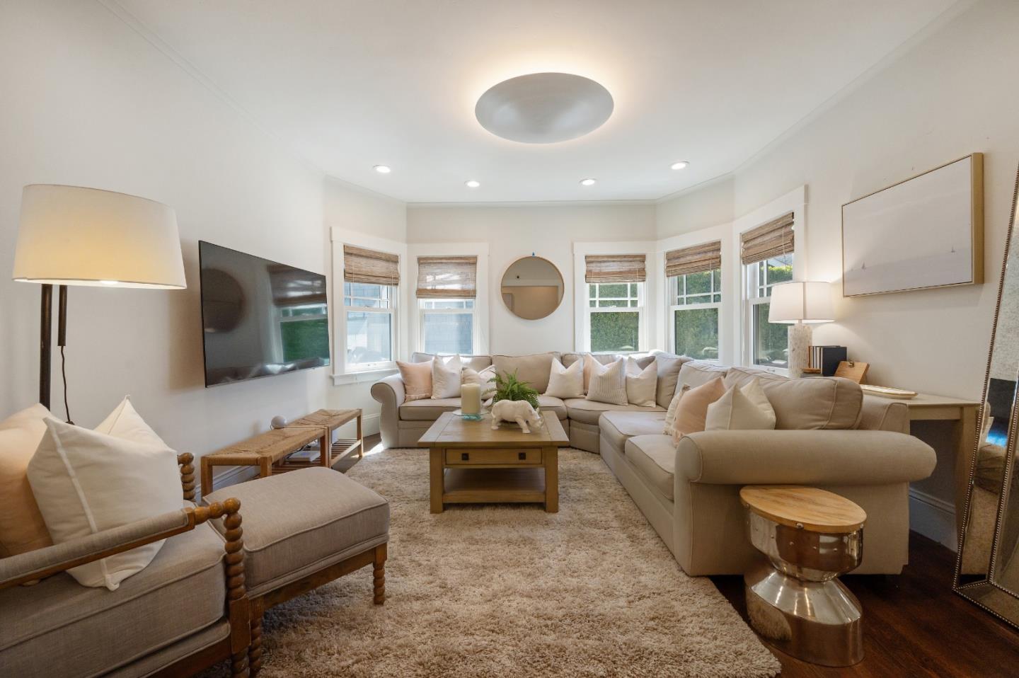 170 Warren Road San Mateo, CA 94401 - Photo 32 of 56 a living room with furniture and a flat screen tv