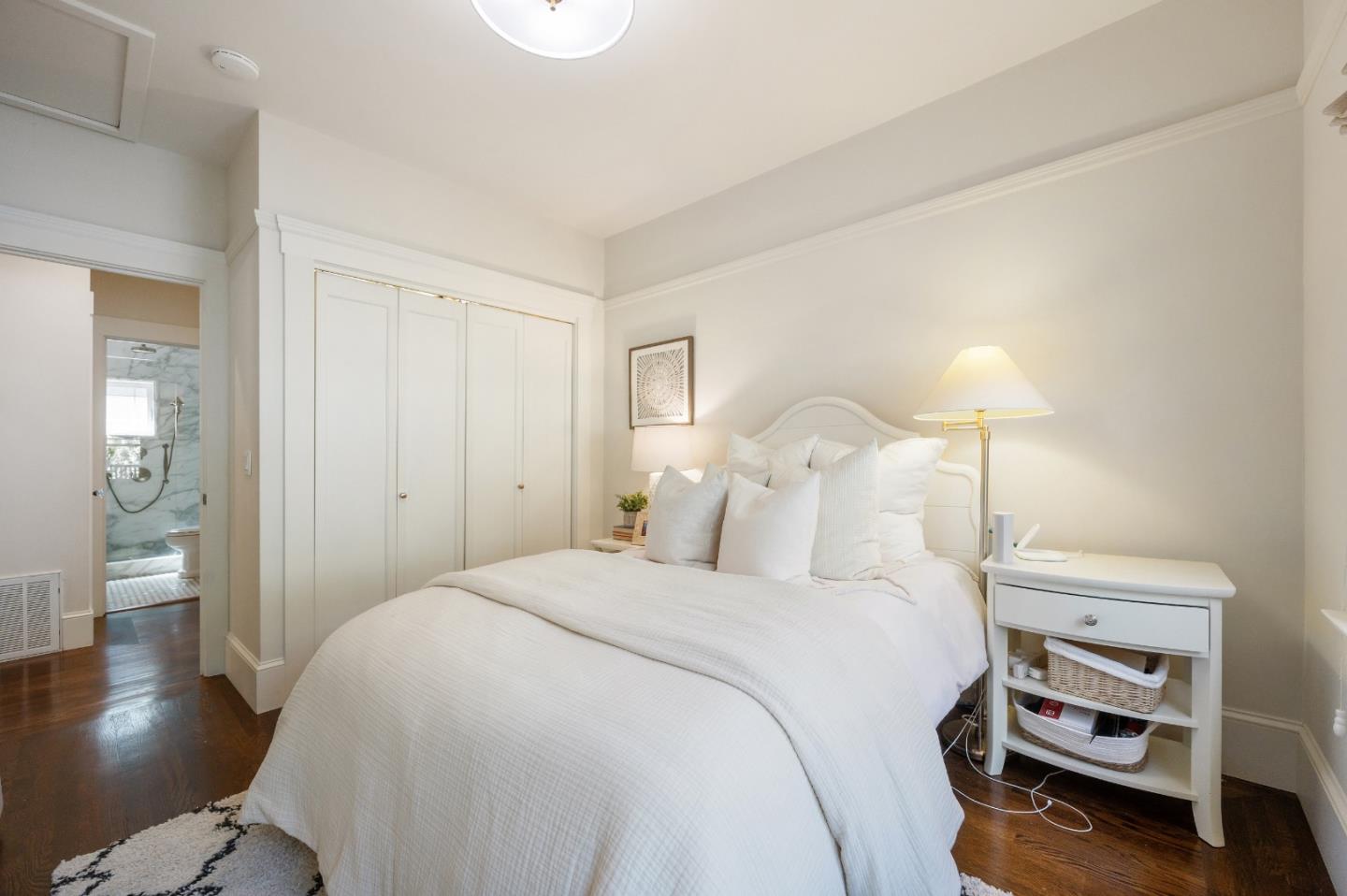 170 Warren Road San Mateo, CA 94401 - Photo 37 of 56 a bedroom with a bed and wooden floor