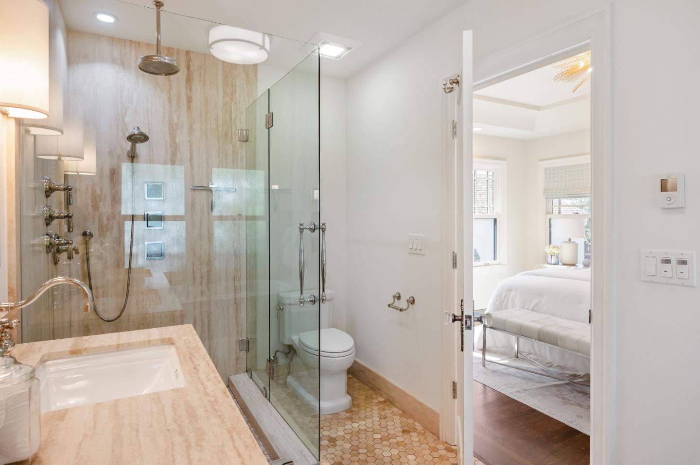 170 Warren Road San Mateo, CA 94401 - Photo 39 of 56 a bathroom with a double vanity sink a toilet and shower