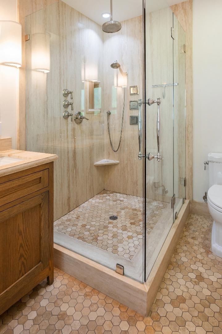 170 Warren Road San Mateo, CA 94401 - Photo 40 of 56 a bathroom with a granite countertop sink a toilet and shower