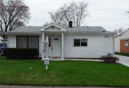 274 East Dennis Road Wheeling, IL 60090 - Photo 1 of 1 a front view of a house with a garden