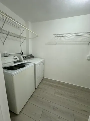 a utility room with dryer and washer