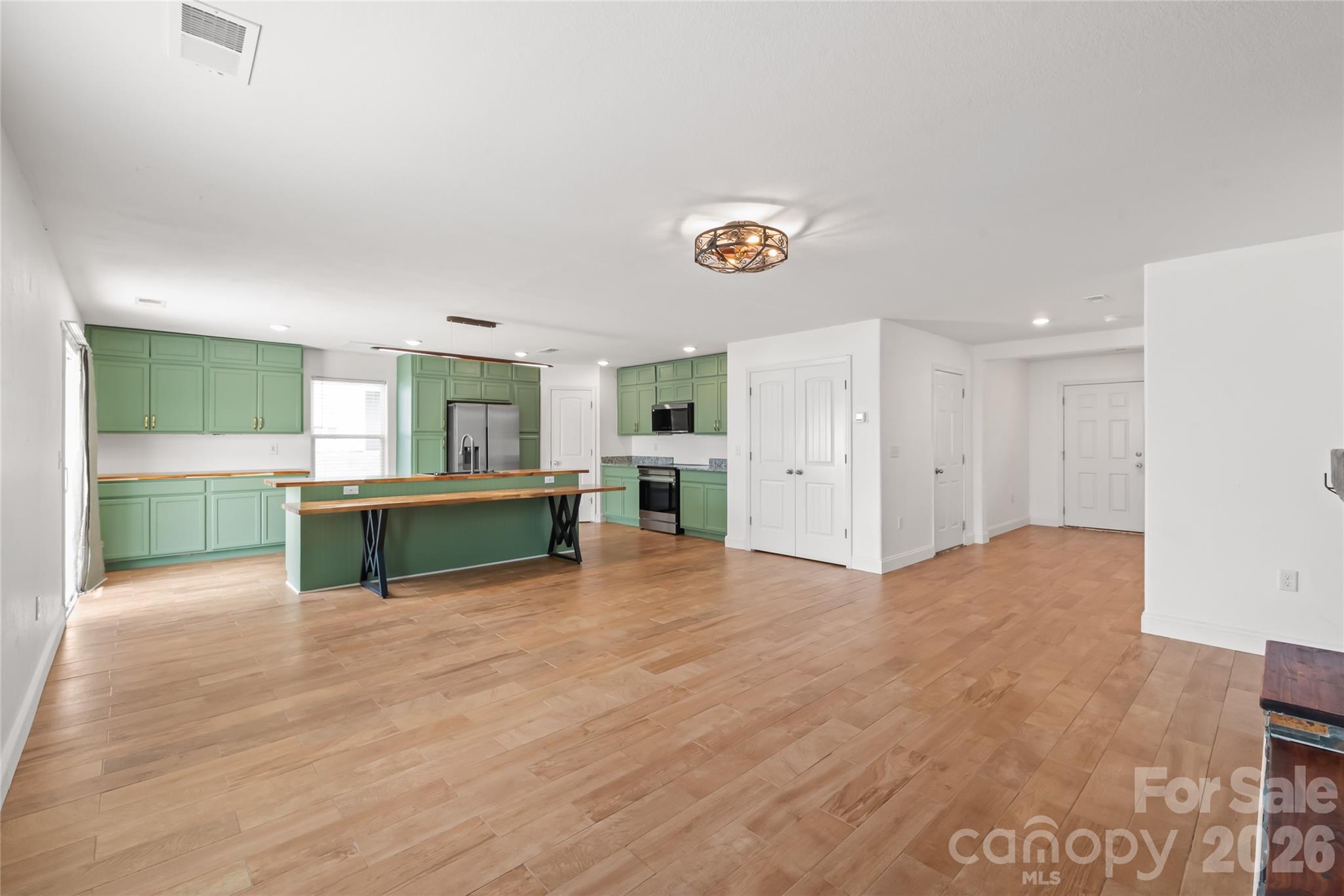 1232 Phifer Road Kings Mountain, NC 28086 - Photo 3 of 36 a view of an empty room with a kitchen and window