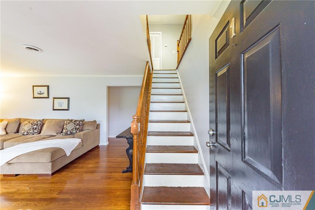 1 Colonial Road Roselle, NJ 07203 - Photo 3 of 35 a view of entryway and hall with wooden floor