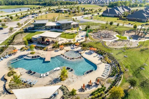 a view of a swimming pool from a balcony