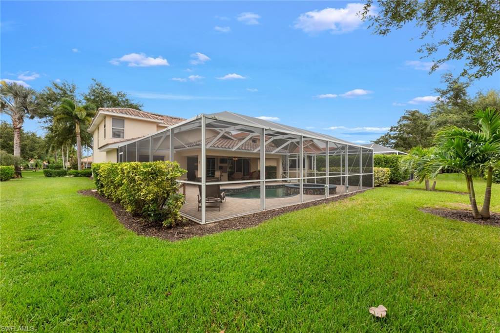 19724 Villa Rosa Loop Estero, FL 33967 - Photo 41 of 50 a view of a house with a yard