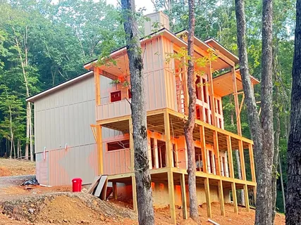 a view of a house with a backyard