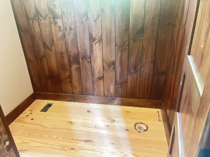 a bathroom with a bathtub and shower