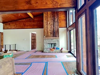 a wooden bench sitting on top of a wooden floor