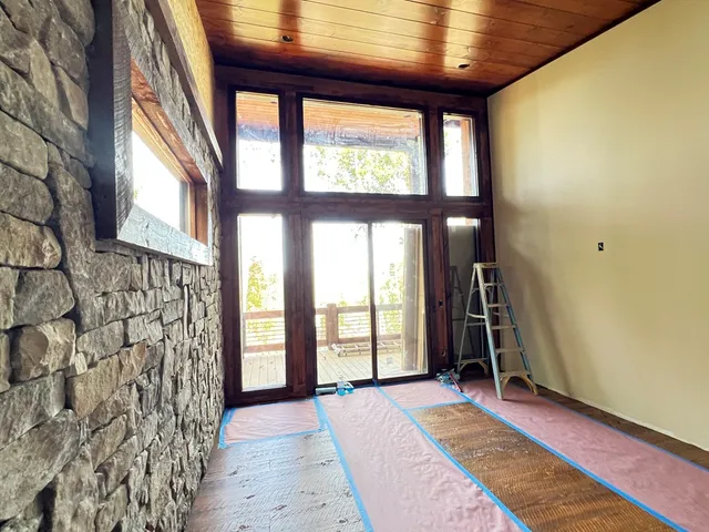 a kitchen with stainless steel appliances granite countertop a sink refrigerator and cabinets